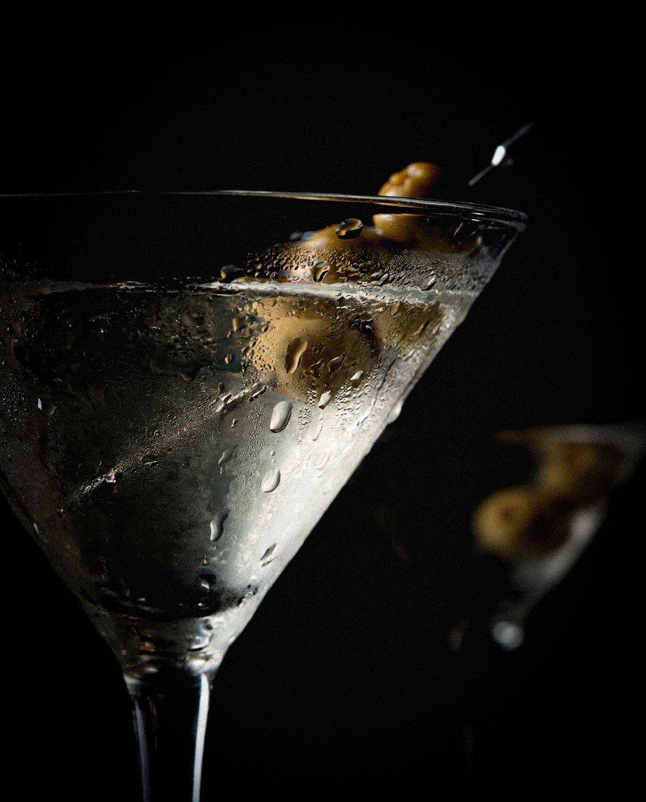 Martini with olives in the dark