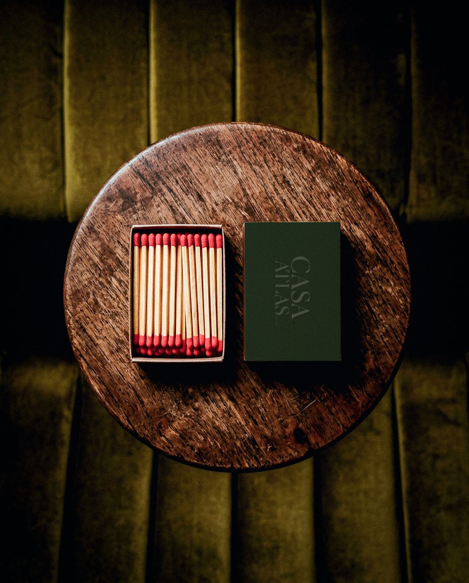 Casa Atlas matchbox on a wooden table